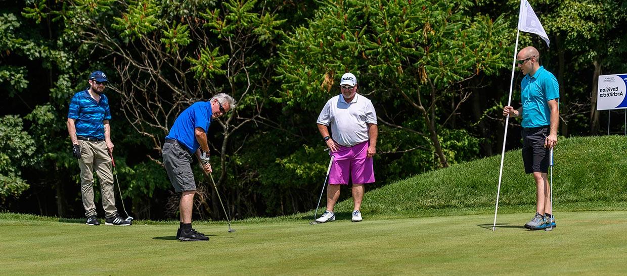 Golfers on the putting green